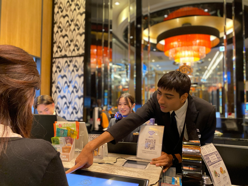 the scene of karan working as a staff on check-ins